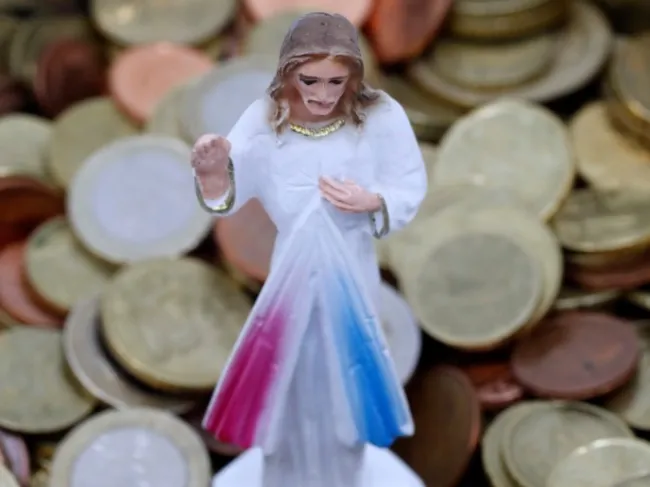 jesus statue with money